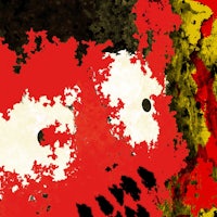 a painting of a red face with black eyes