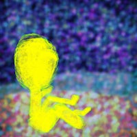 a picture of a yellow alien sitting on the ground